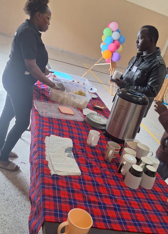 Mary serving guests at a corporate catering event